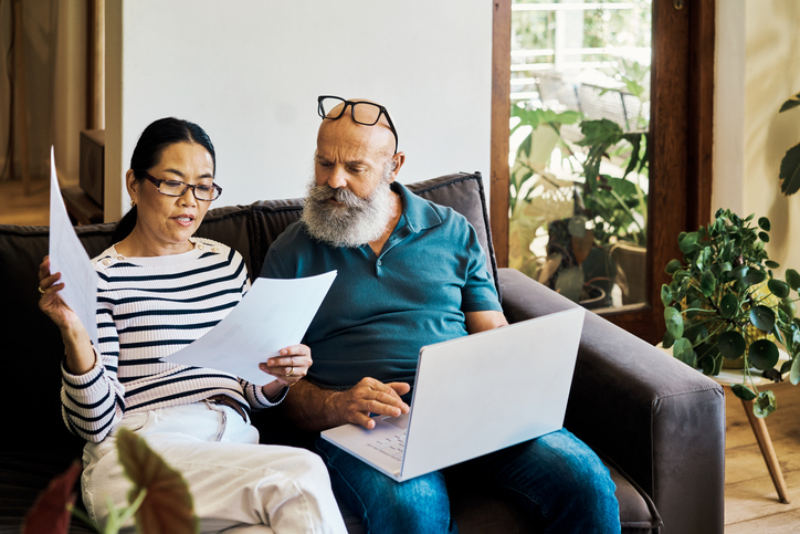 A senior couple reviewing their Social Security benefits.